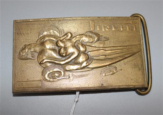 A Pirelli brass buckle with Salvador Dali design